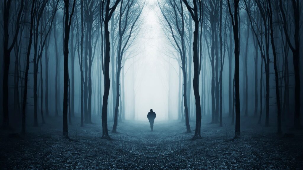 creepy slender man in foggy woods