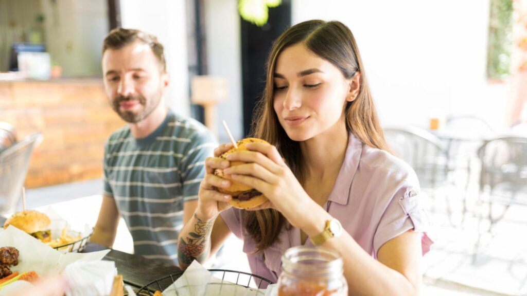 woman about to eat big-sized burger 