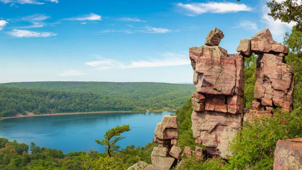 Panoramic view of Devil's Doorway rock formation with beautiful landscape in the background.