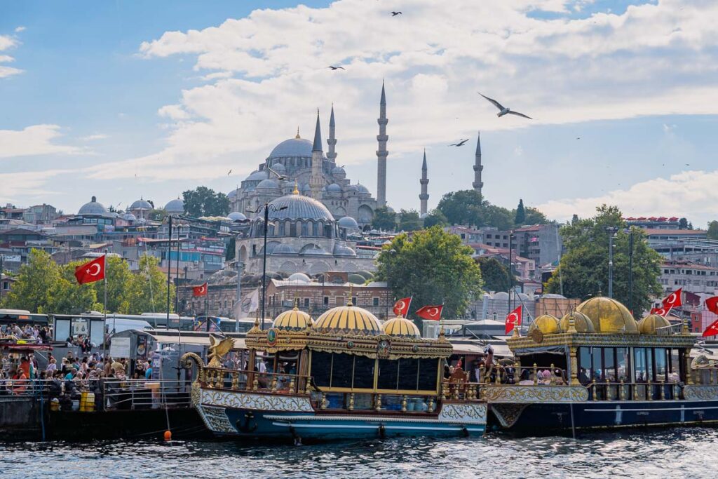 Ferry boats sitting in front of Mosque in Istanbul