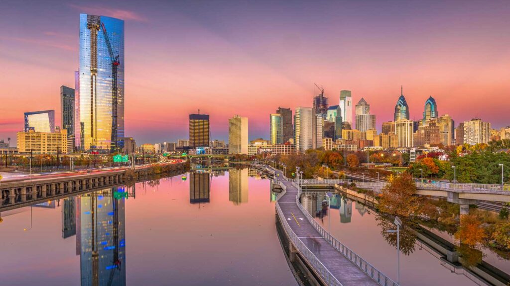 Philadelphia, Pennsylvania, USA downtown city skyline on the Schuylkill River at twilight.