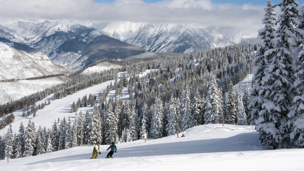 Colorado, Winter Park, two persons snowboarding