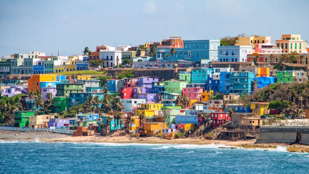 Puerto Rico, Bright colorful houses line the hills overlooking the beach in San Juan