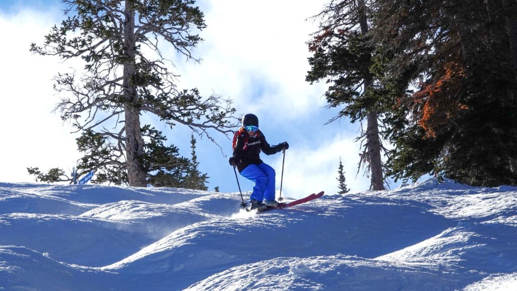 Expert mature woman mogul skier. Brighton ski resort, Utah