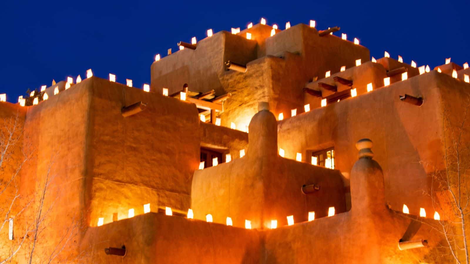 New Mexico, Santa Fe, Farolitos Pueblo in Christmas Lights