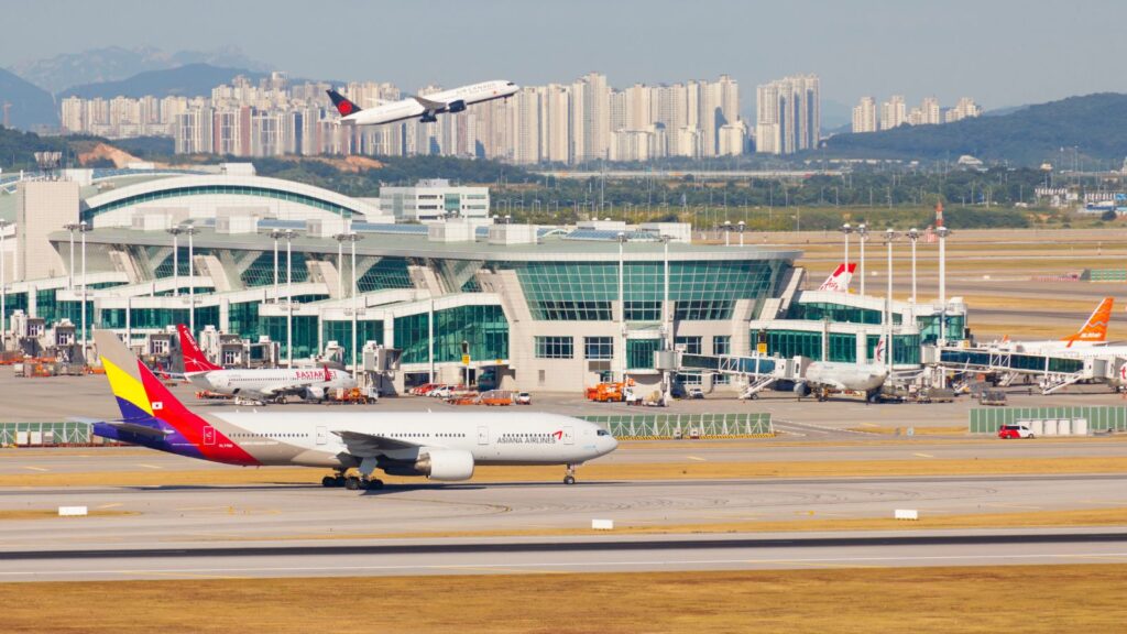 South Korea, Seoul, Incheon International Airport Passenger terminal with Aircraft