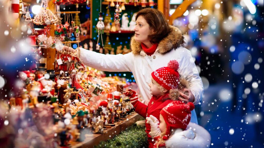 Family shopping Christmas presents at market