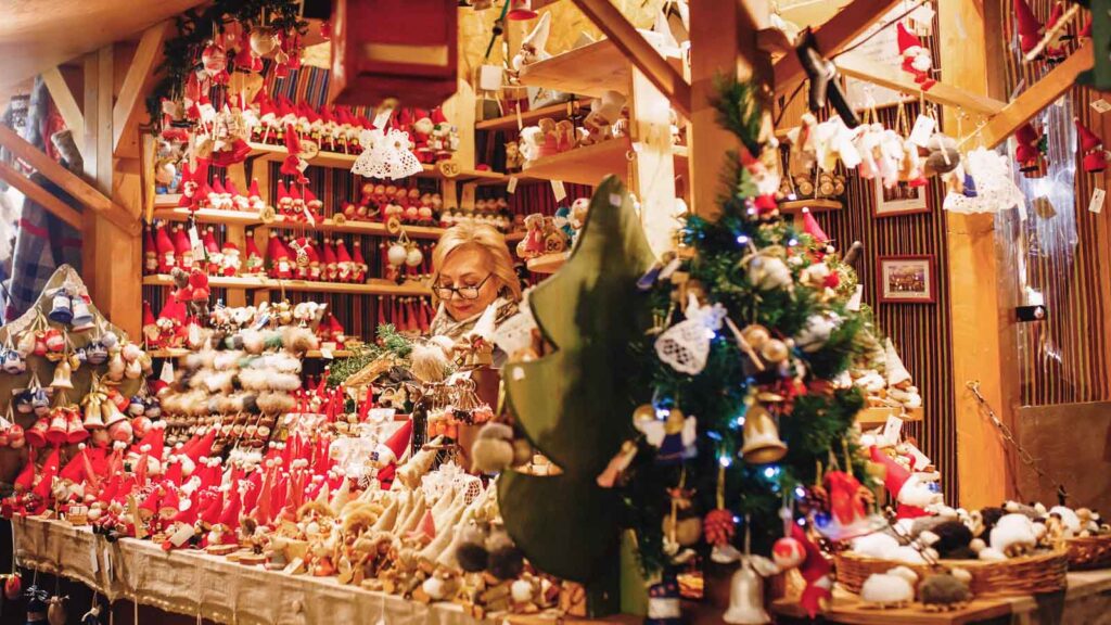 Close-up view on the arty decorated souvenir shop with Xmas toys and dolls in Tallinn Christmas market