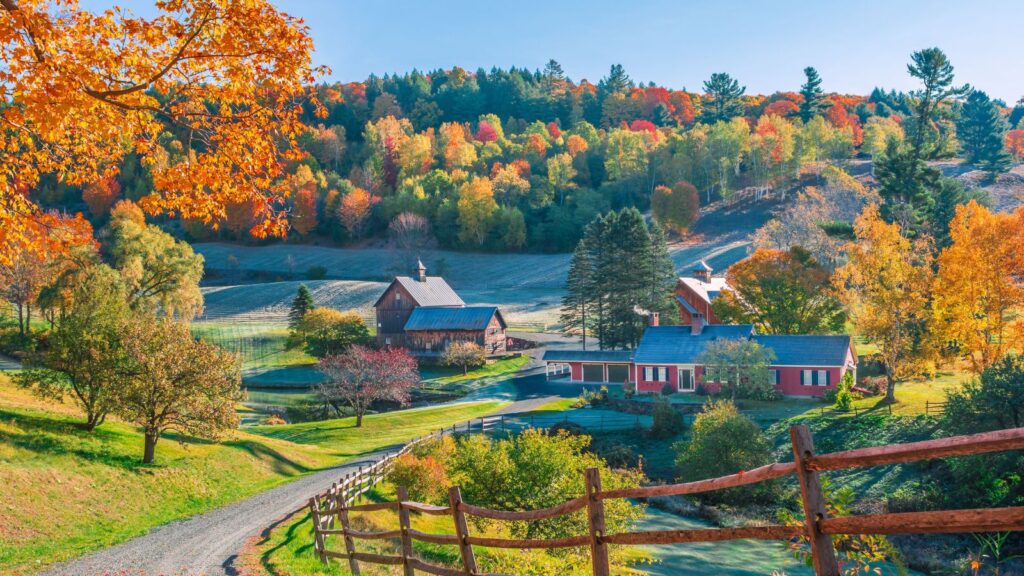 Vermont, An early autumn foliage scene of houses in Woodstock