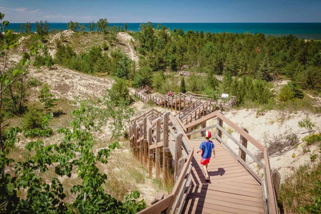 Boy hiking along dune succession trail in Indiana Dunes National Park.