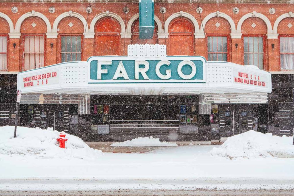 Fargo, USA - March 7 2011: Downtown Fargo on Broadway with theater during a snow storm