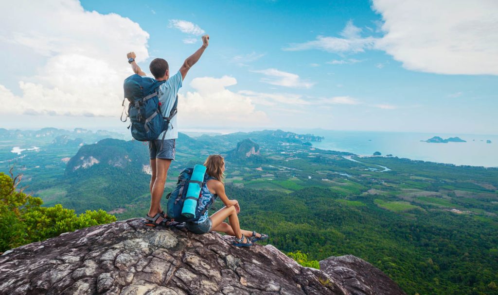 Hikers standing on top of the mountain
