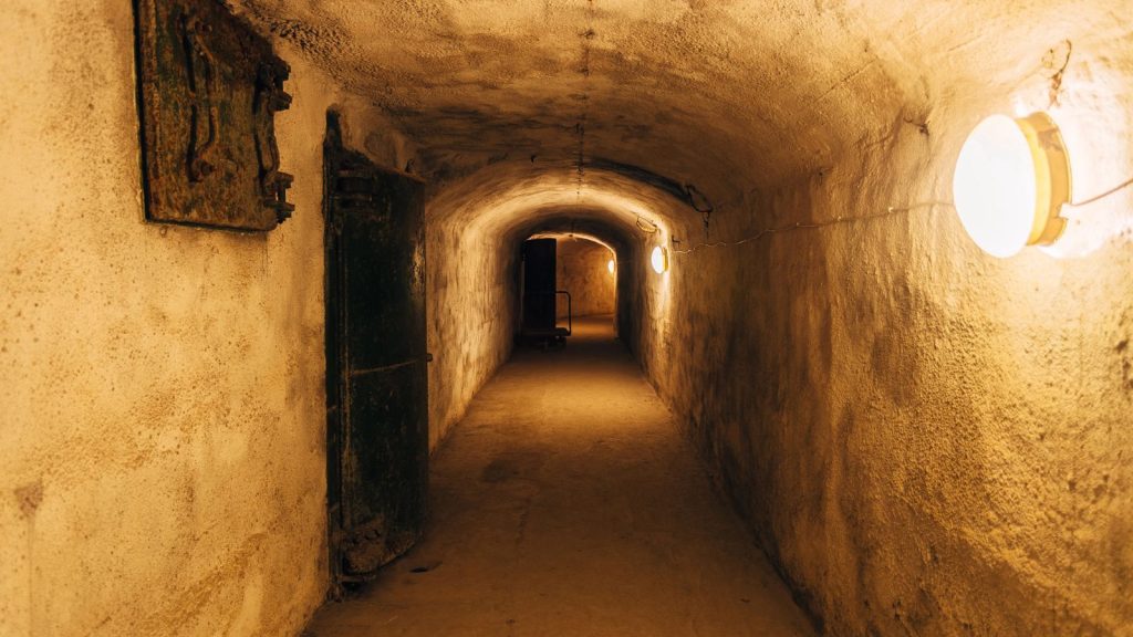 Dark corridor of old underground Soviet military bunker under fortification