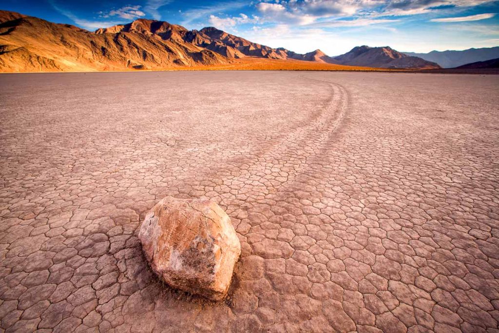 sunset view of The Racetrack Playa, or The Racetrack, is a scenic dry lake feature with "sailing stones" that inscribe linear "racetrack" imprints.