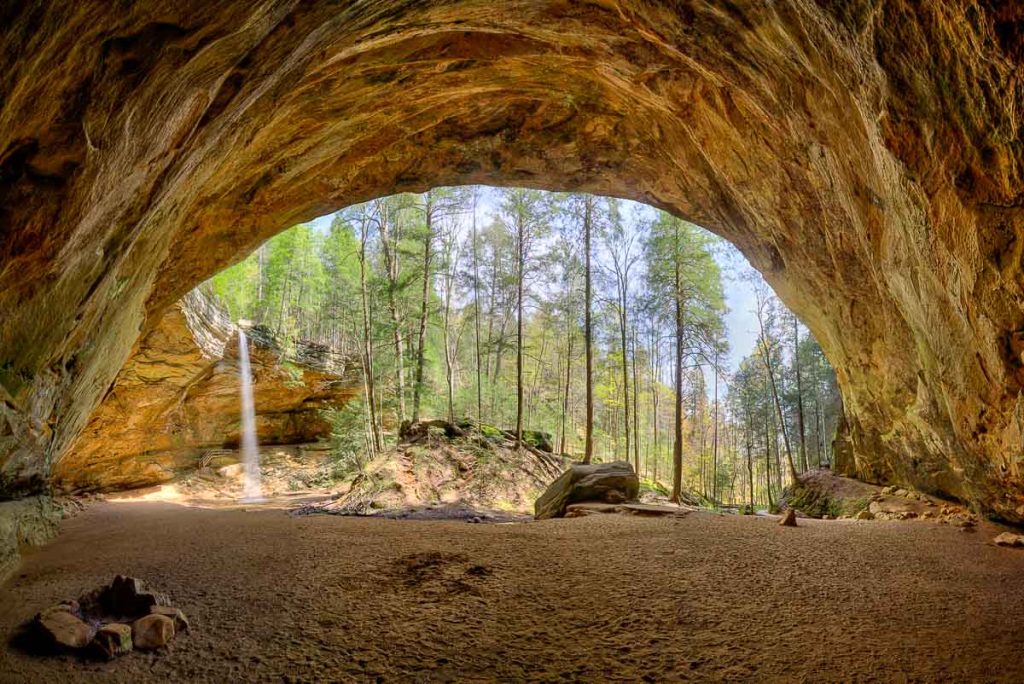 Ash Cave waterfall pano. Ash Cave is the largest, most impressive recess cave in the state of Ohio and can be found in Hocking Hills state park. The horseshoe-shaped cave is massive; measuring 700 feet from end to end, 100 feet deep from the rear cave wall to its front edge with the rim rising 90 feet high.