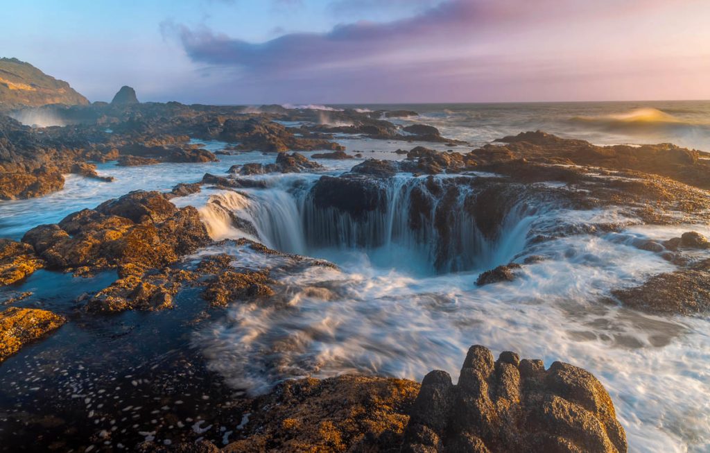 Ocean water flow at Thor's Well during sunset, Cape Perpetua, Oregon Coast.