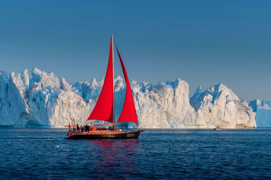 Sailboat Beautiful landscape with large icebergs