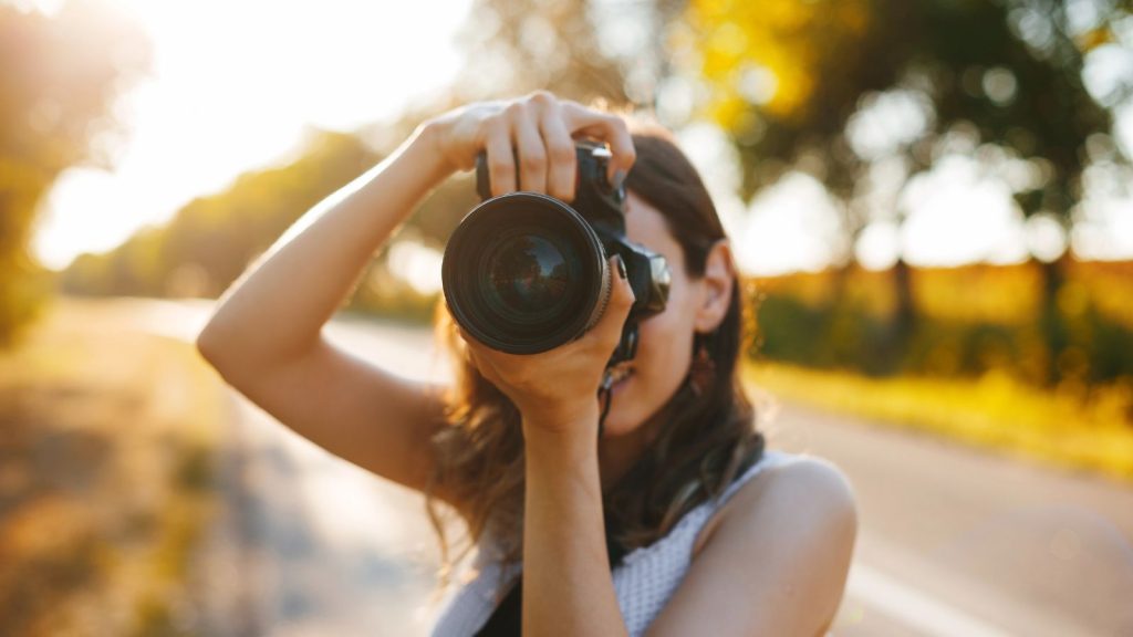 Creative photographer woman while travelling