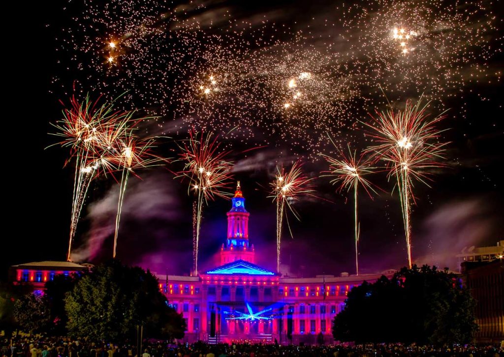 Denver, Colorado State Capitol illuminated during a fireworks celebration at night