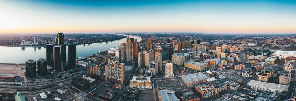 Michigan, Detroit, panoramic cityscape along the Detroit River with the Renaissance Center in the foreground and Windsor
