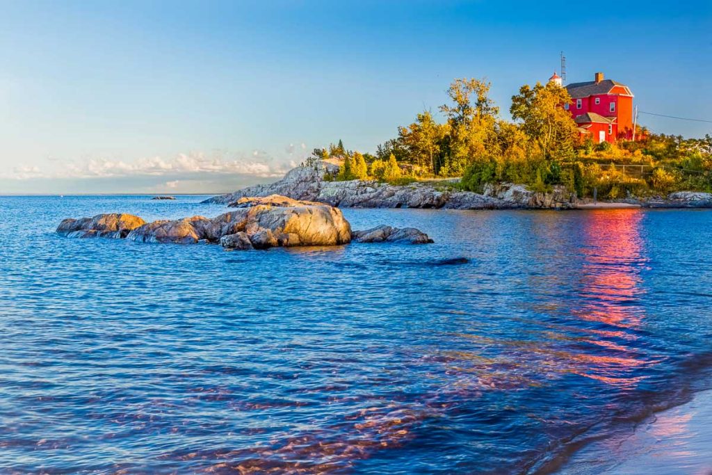 Michigan, Red lighthouse on Lake Superior shore. The historic Marquette Harbor Lighthouse in Marquette