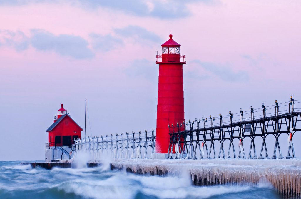 Michigan, Winter landscape of the Grand Haven Lighthouse, pier, and catwalk at dawn, Lake Michigan