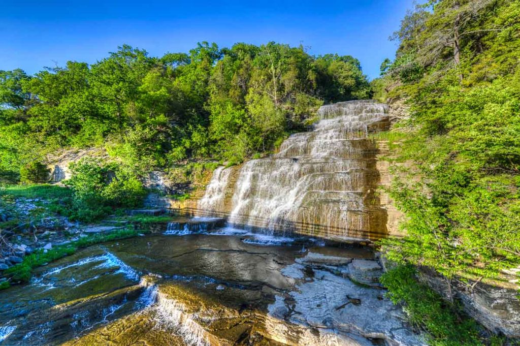 New York, Hector Falls, Finger Lakes covered in greens