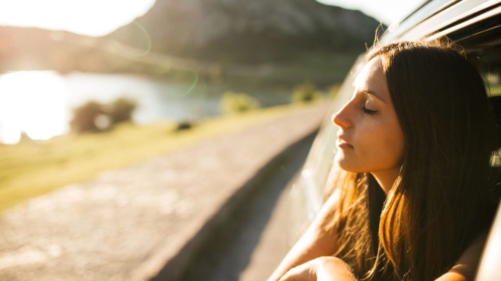 Woman in a roadtrip during spring
