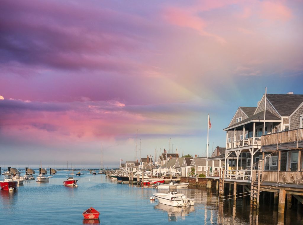 Beautiful homes of Nantucket, Massachusetts. Houses over water at dusk.
