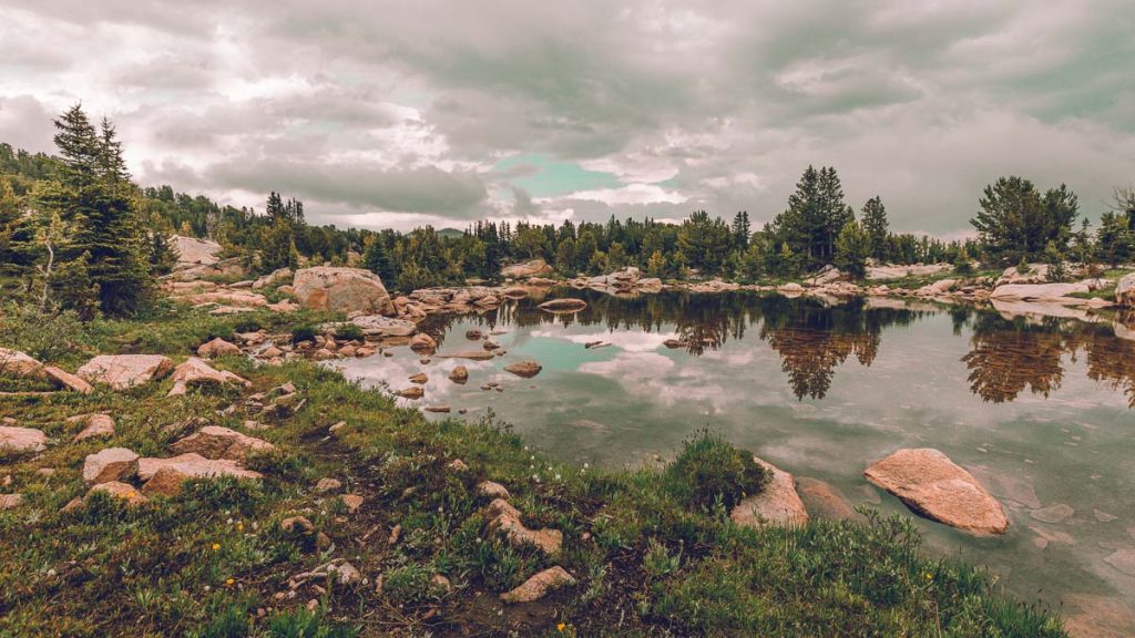 Montana, Absaroka-Beartooth Highway alpine lake surrounded by rugged mountain peaks(1)