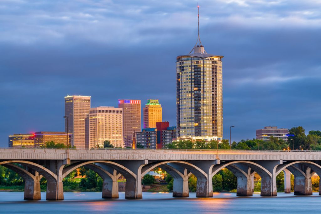 Oklahoma, Tulsa downtown skyline along the Arkansas River at dusk