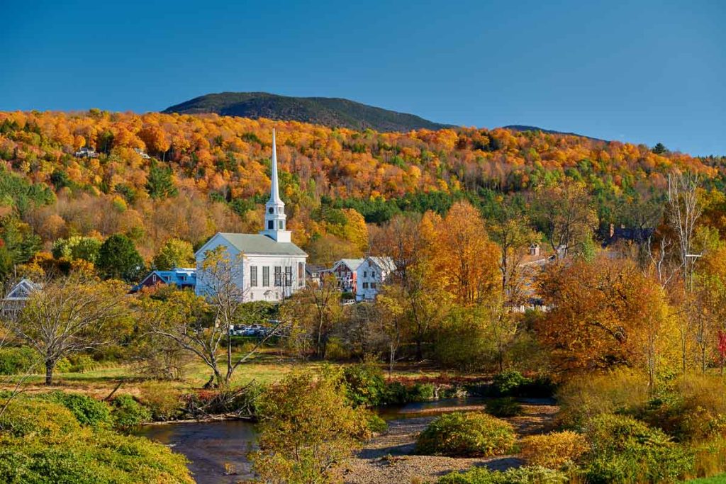 Iconic New England church in Stowe town at autumn in Vermont, USA