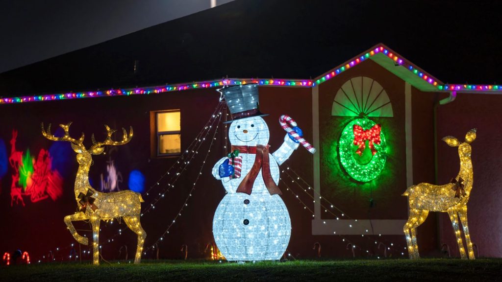 Front yard with brightly illuminated christmas decorations