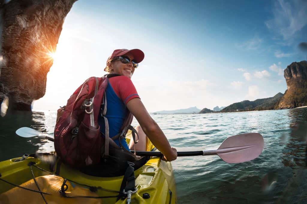 Sea kayaking, Woman paddling a sea kayak